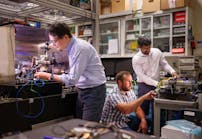 Sandia National Laboratories&rsquo; Scientist Jongmin Lee (left) prepares a rubidium cold-atom cell for an atom interferometry experiment while Scientists Ashok Kodigala (right) and Michael Gehl initialize the controls for a packaged single-sideband modulator chip.