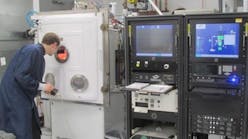 New optical coating chamber is part of Optimax's expanison.