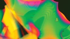 A dielectric multilayer stack coating, measuring 0.5 &mu;m in total thickness, that has been intentionally released from the optic surface before imaging. The image was taken at 200x using a Nomarski microscope.